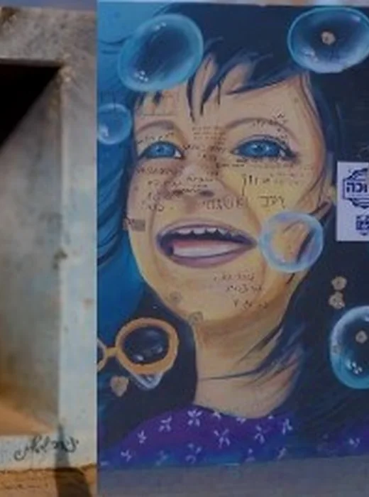 Mural of a smiling girl on a roadside shelter megunit, painted in remembrance
