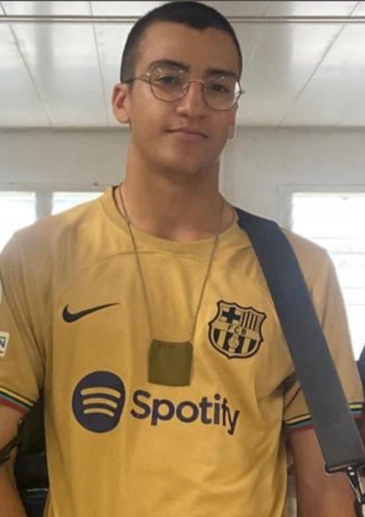 Shaked Dahan wearing a yellow football shirt