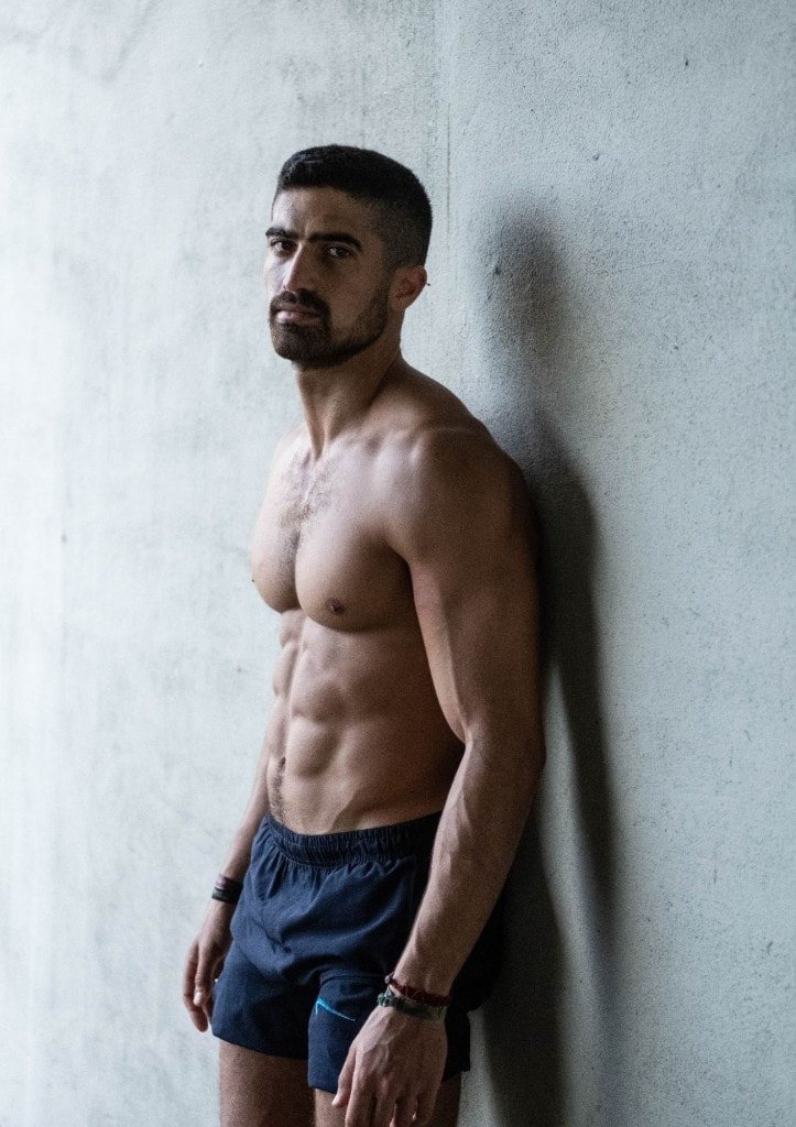 Ziv Hagbi leaning against a wall, portrait